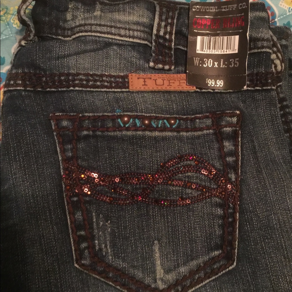 Cowgirl Tuff jeans.